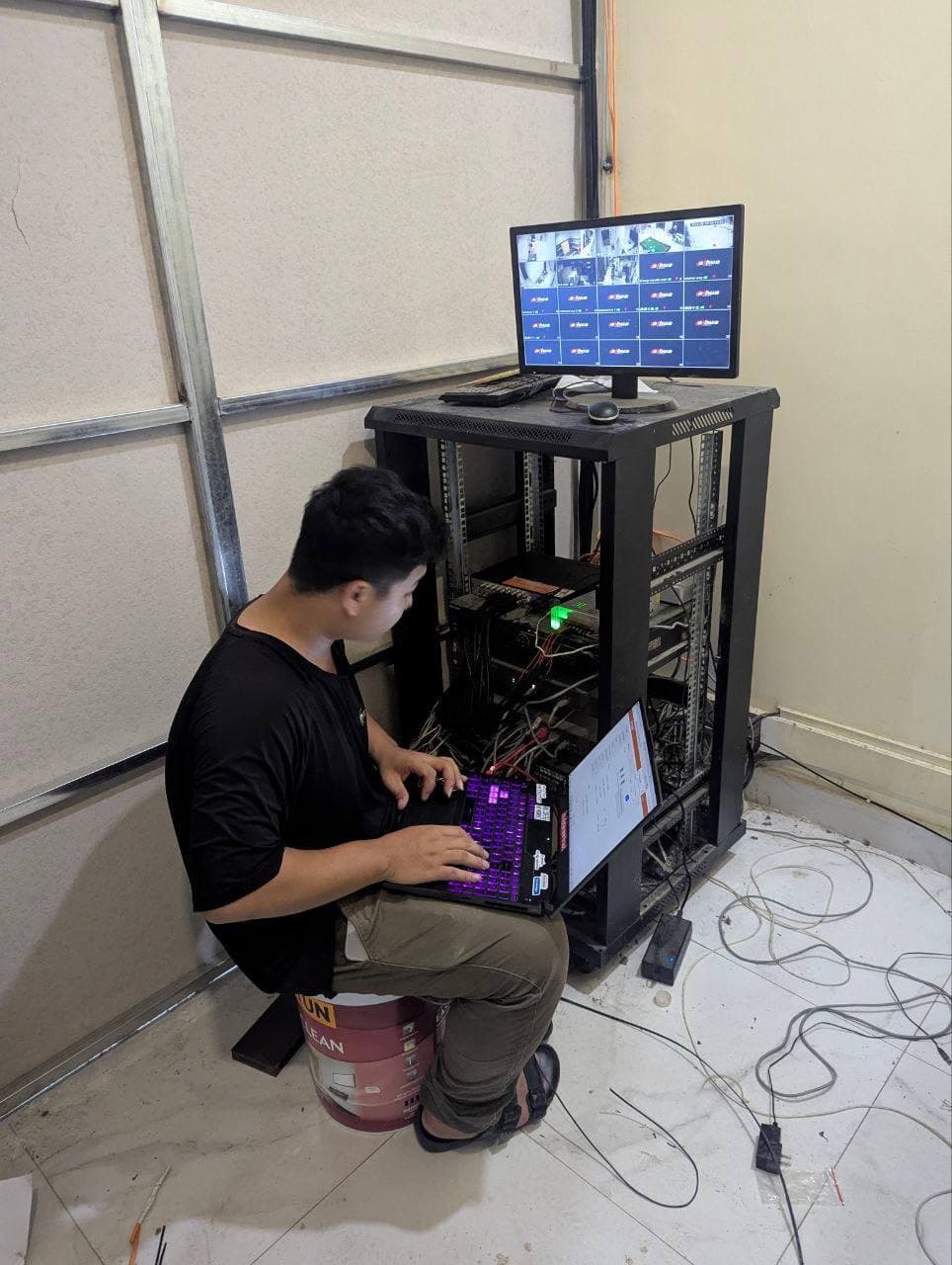 Engineer configuring a camera network on site