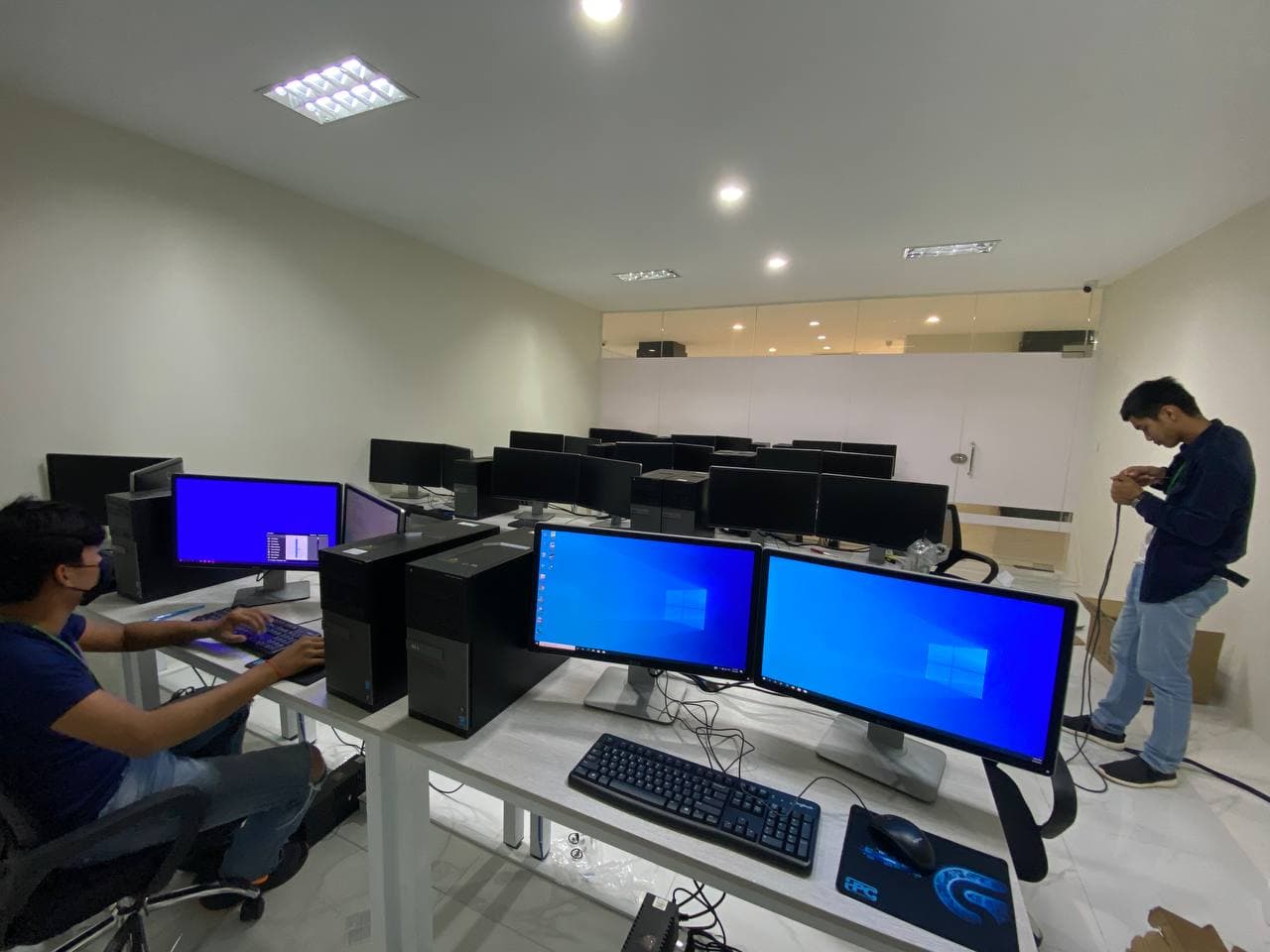 Team testing workstations before delivery